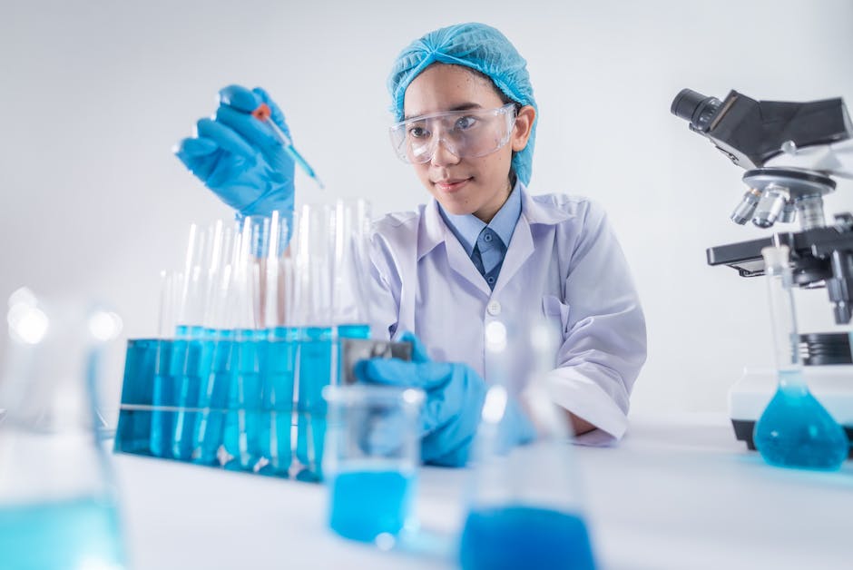 An image showing a chemist performing experiments in a laboratory.